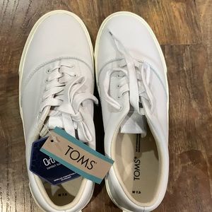 Tom’s casual shoes. Remind me of Ked’s. They are whitish. Not a bright white.